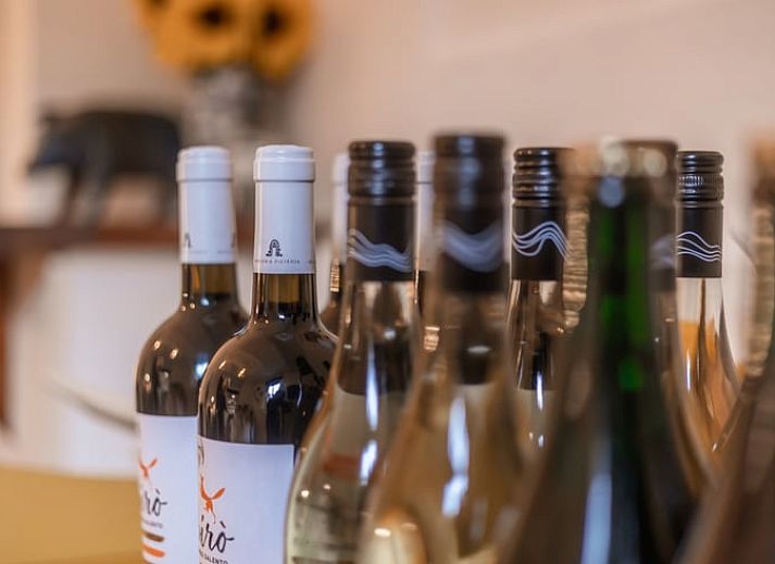 Nice reading corner in Holiday Home in Maastricht, South Limburg with books and a comfortable chair.