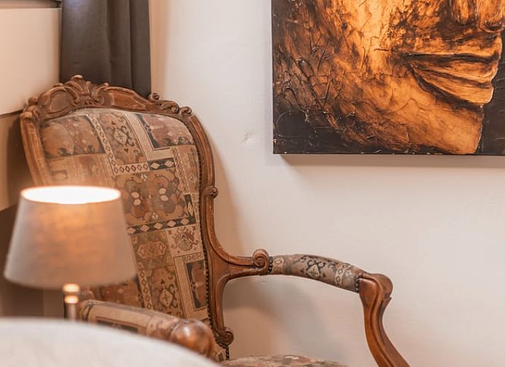 Welcome package in Holiday Home in Maastricht, South Limburg with information folder and flowers.