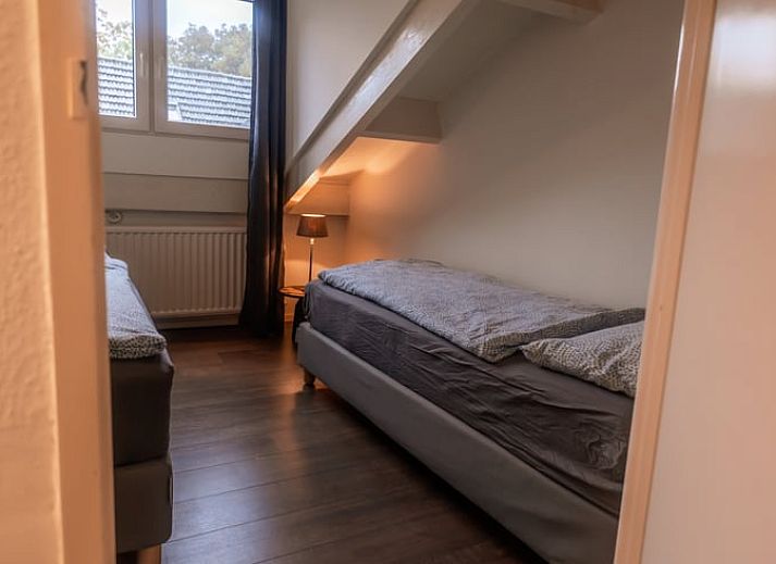 Welcome package in Holiday Home in Maastricht, South Limburg with information folder and flowers.