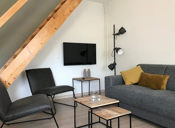 Uitzicht op groene tuin bij Vakantiehuisje in Heijenrath, Zuid Limburg, ideaal voor ontspanning en natuurbeleving.