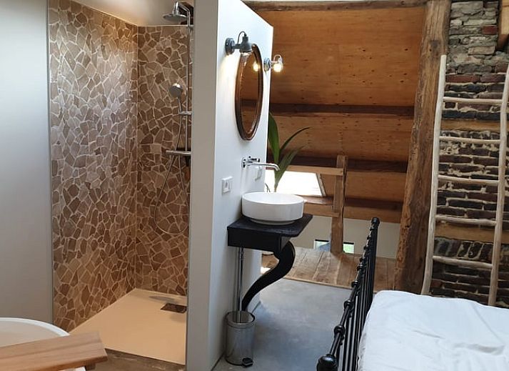 Bright interior of Holiday Home in Heijenrath, South Limburg. Modern kitchen with wooden elements and lots of natural light.