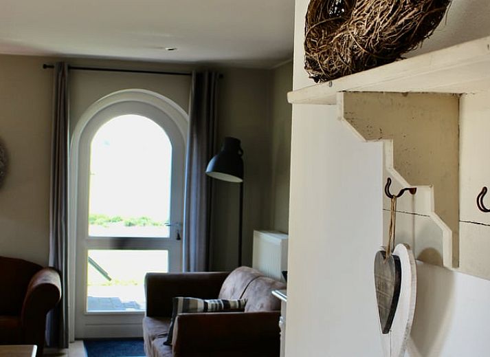 Terras met uitzicht op het landschap bij Vakantiehuisje in Gulpen, Zuid Limburg, ideaal voor ontspanning in de Limburgse natuur.