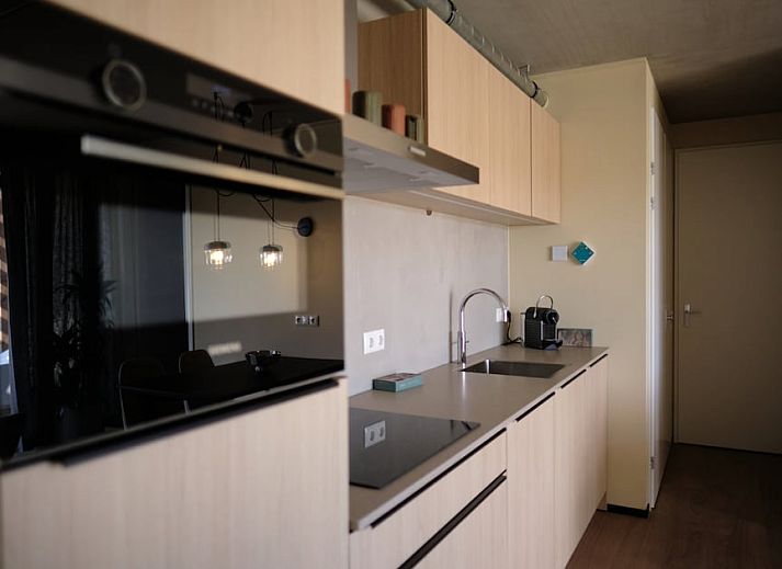 Enjoy peace and quiet on the terrace of Hillside Comfort 4, a vacation home in Gulpen, South Limburg, surrounded by lush nature.