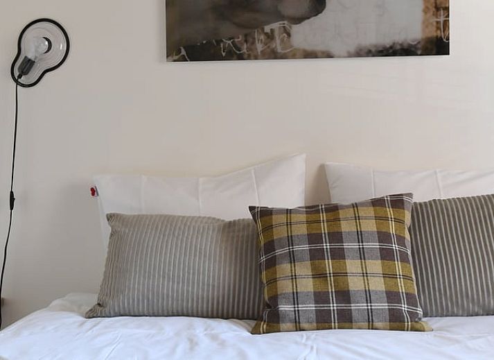 Aussenansicht des Ferienhauses in Klimmen, Suedlimburg, mit traditioneller Architektur und schoenem Garten.