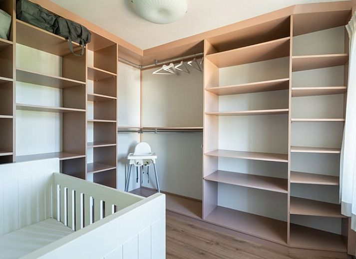 Stylish living room of Holiday home in Klimmen, South Limburg, with wooden floor and modern interior.