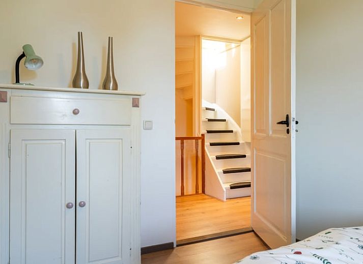 Cozy sitting area in Holiday Home in Klimmen, South Limburg, with comfortable sofa and dining area.