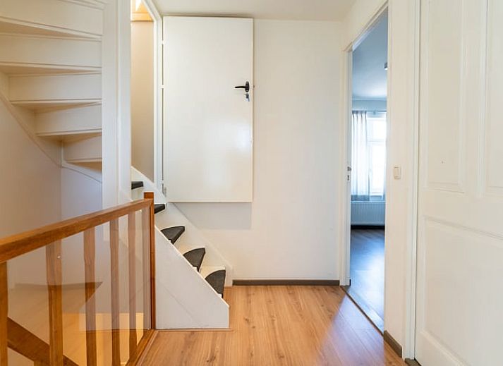 Cozy sitting area in Holiday Home in Klimmen, South Limburg, with comfortable sofa and dining area.