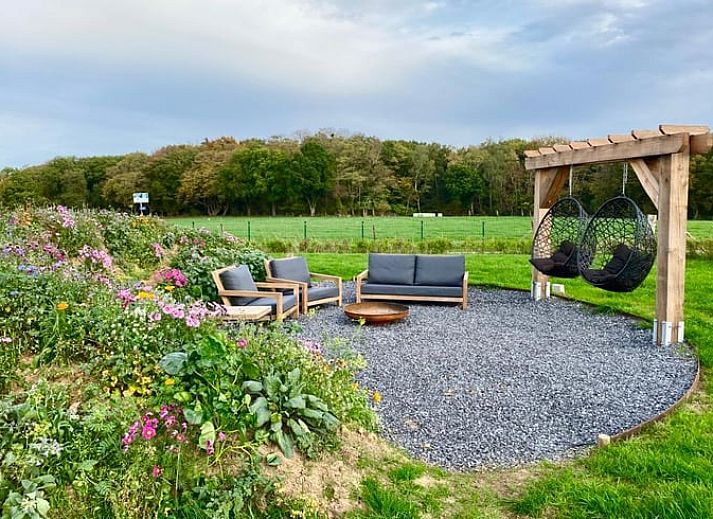 Dining room with fireplace in Holiday home in Wijlre, ideal for cozy evenings in South Limburg.