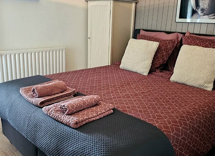 Bloeiende tuin bij Huisje in Epen, vakantiehuis in Zuid Limburg met uitzicht op het landschap.