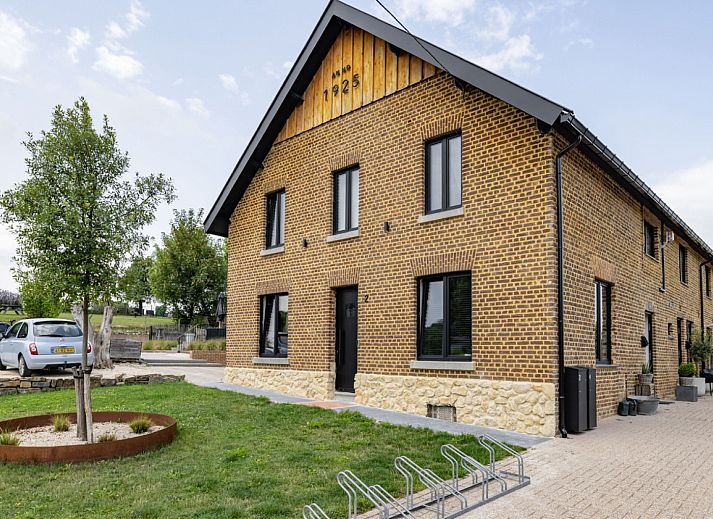 Ferienhaus L328 in Epen, Suedlimburg, mit charmanter Backsteinfassade und gruener Umgebung, ideal fuer einen erholsamen Aufenthalt.