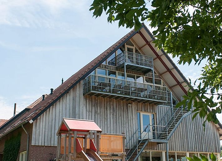 Holiday home in Epen, South Limburg, offers rustic accommodation with solar panels and sweeping views over green fields.