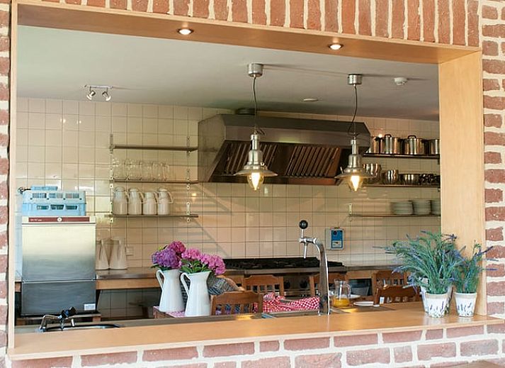 Holiday home in Epen, South Limburg, offers rustic accommodation with solar panels and sweeping views over green fields.