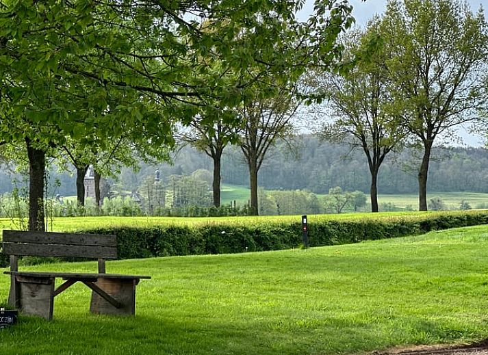 Aerial view of vacation home in Epen, South Limburg, with green landscape and caravans in the surrounding area, ideal for a relaxing stay.