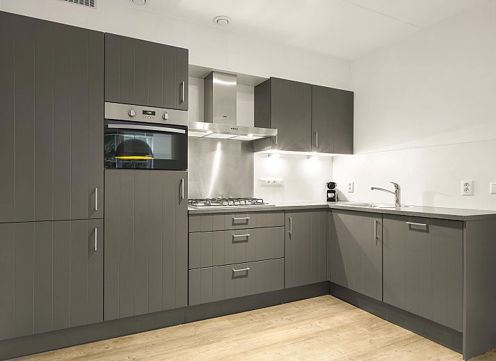 Gemuetliches Wohnzimmer in der Waufsberg 8-Personen-Villa Mets Hoes in Noorbeek, Suedlimburg mit komfortabler Sitzecke.