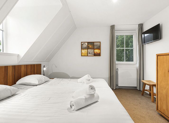 Gemuetliches Wohnzimmer in der Waufsberg 8-Personen-Villa Mets Hoes in Noorbeek, Suedlimburg mit komfortabler Sitzecke.