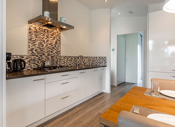 Cozy living room in Holiday Home Green Resort Mooi Bemelen overlooking nature in Limburg.