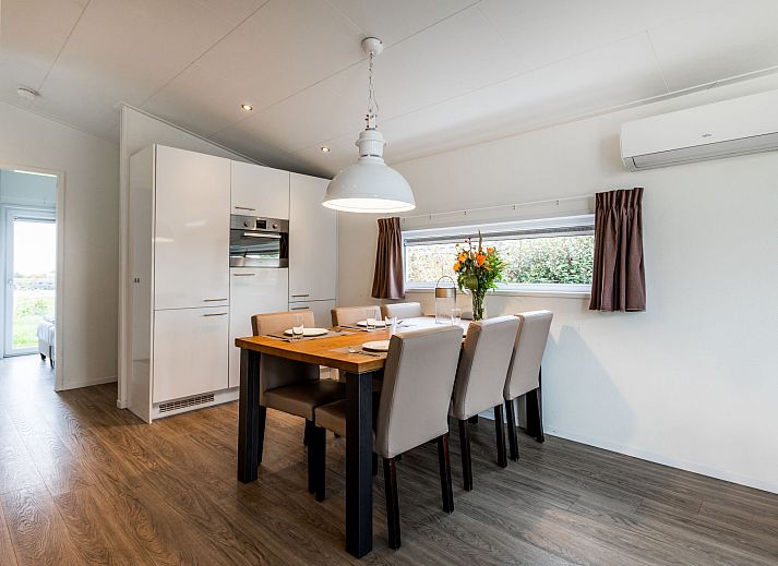 Cozy living room in Holiday Home Green Resort Mooi Bemelen overlooking nature in Limburg.