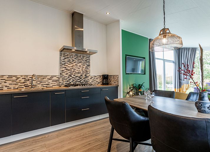Cozy living room in Holiday Home Green Resort Mooi Bemelen overlooking nature in Limburg.