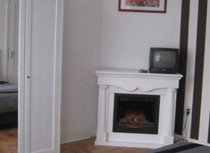 Gezellige woonkamer van Huize 'de hommert' Hoensbroek, vakantiehuis in Zuid Limburg met ruime eetkamer en natuurlijke lichtinval.