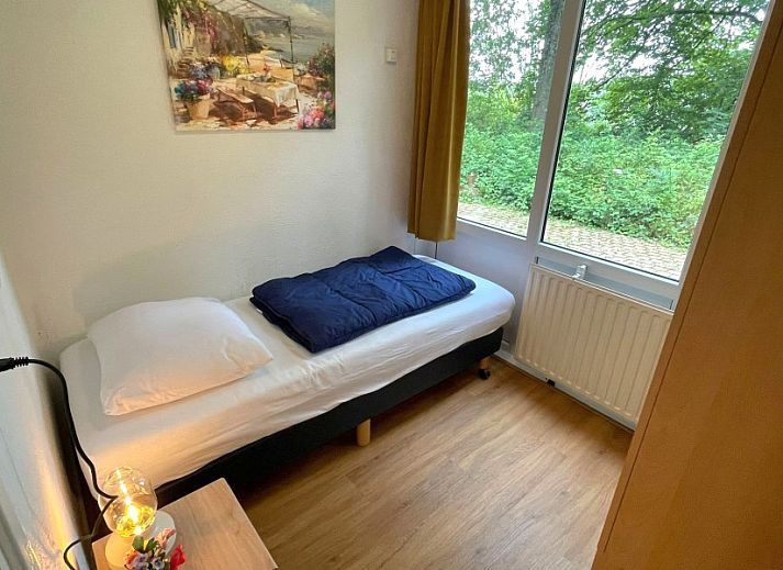 Buitenzijde van Butterflies vakantiehuis in Simpelveld, Zuid Limburg met terras en groene omgeving voor ontspanning.