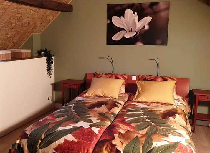 Knusse woonkamer in Huisje in Valkenburg aan de Geul, vakantiehuis in Zuid Limburg, met comfortabele meubels.