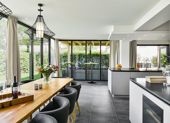 Cozy living room with wood stove in Kasteeldomein De Cauberg 10-person Villa Culinair, Valkenburg a.d. Geul.