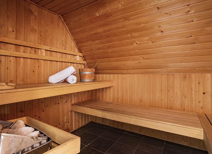 Stylish sitting area with TV in Kasteeldomein De Cauberg 10-person Villa Culinair, Valkenburg a.d. Geul.