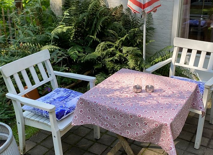 Comfortabele slaapkamer in Huisje in Mook, een uitnodigend vakantiehuis in Zuid Limburg, ideaal voor een ontspannen verblijf.