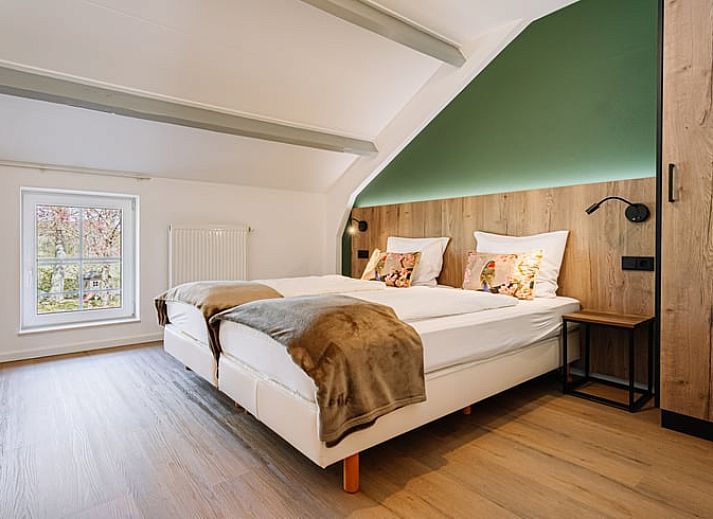 Geniessen Sie den gruenen Aussenbereich des Ferienhauses in Gulpen - Wittem, das im malerischen Suedlimburg liegt und perfekt zum Entspannen ist.