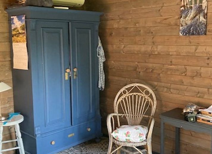 Cozy veranda at Holiday home in Nuth, South Limburg, with sitting area and green surroundings.