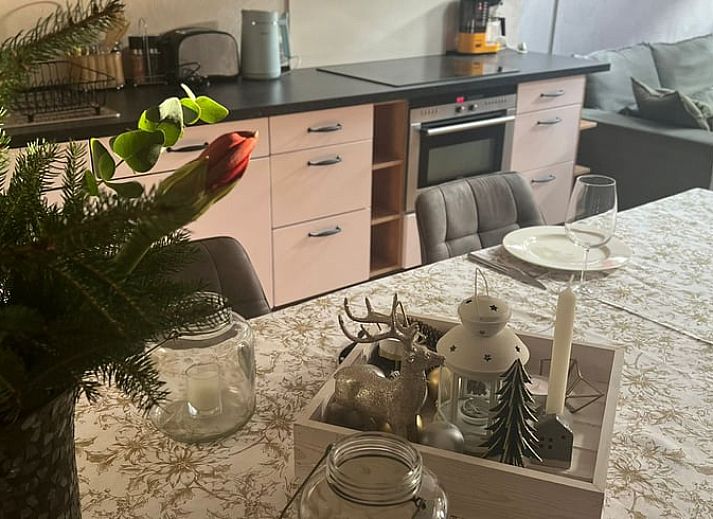 Cozy terrace at Holiday Home in Beutenaken, South Limburg, with rustic stone walls and wrought iron garden furniture for relaxing moments outdoors.