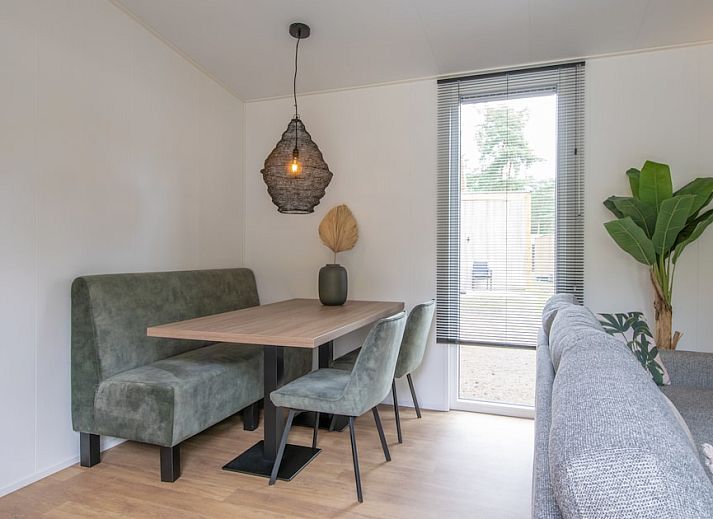 Timber Cottage 4 in Mierlo, North Brabant offers a rustic cottage with veranda, surrounded by the serene nature of De Peel.