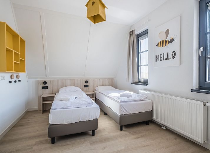 Modern living room of 6-bed bungalow 6CK in Someren, De Peel, North Brabant with open kitchen.