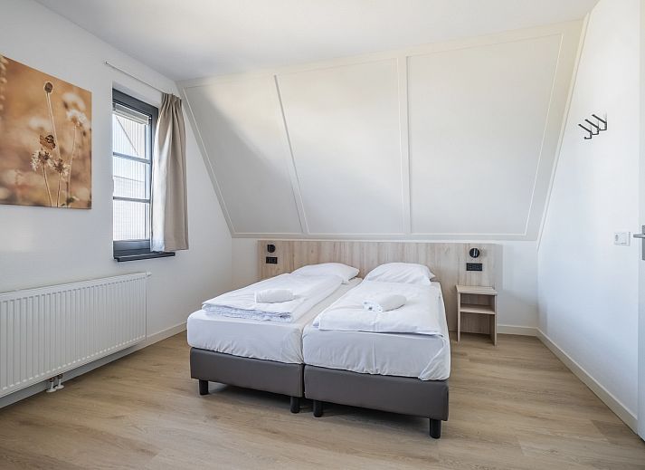 Modern living room of 6-bed bungalow 6CK in Someren, De Peel, North Brabant with open kitchen.