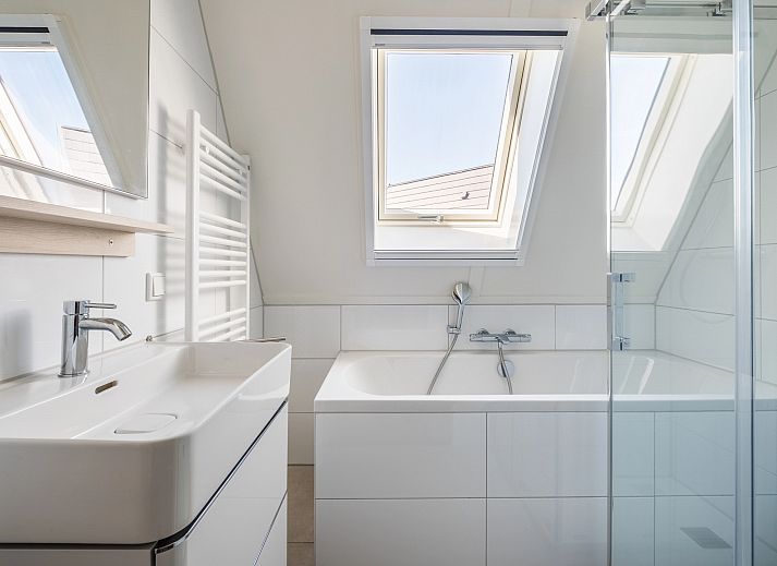 Modern living room of 6-bed bungalow 6CK in Someren, De Peel, North Brabant with open kitchen.