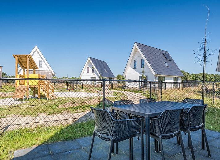 Cozy sitting area in 6-bed bungalow 6CK in Someren, De Peel, North Brabant overlooking garden.