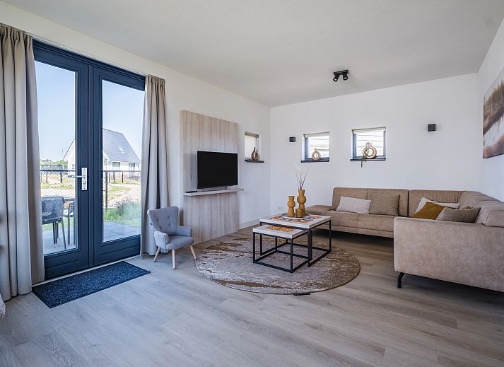 Cozy sitting area in 6-bed bungalow 6CK in Someren, De Peel, North Brabant overlooking garden.