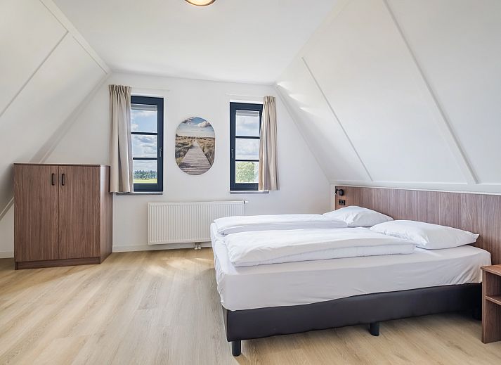 Stijlvolle leeshoek in 6-persoonsbungalow 6L2, Someren, De Peel, Noord Brabant met uitzicht op de omgeving.