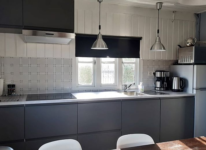 Vakantiehuisje in Aarle-Rixtel, Noord Brabant, met zonnig terras en uitzicht op het platteland.