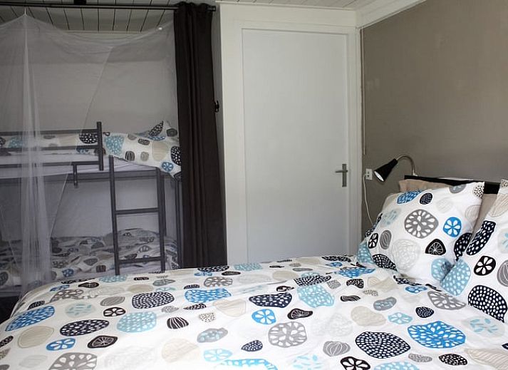 Vakantiehuisje in Aarle-Rixtel, Noord Brabant, met zonnig terras en uitzicht op het platteland.