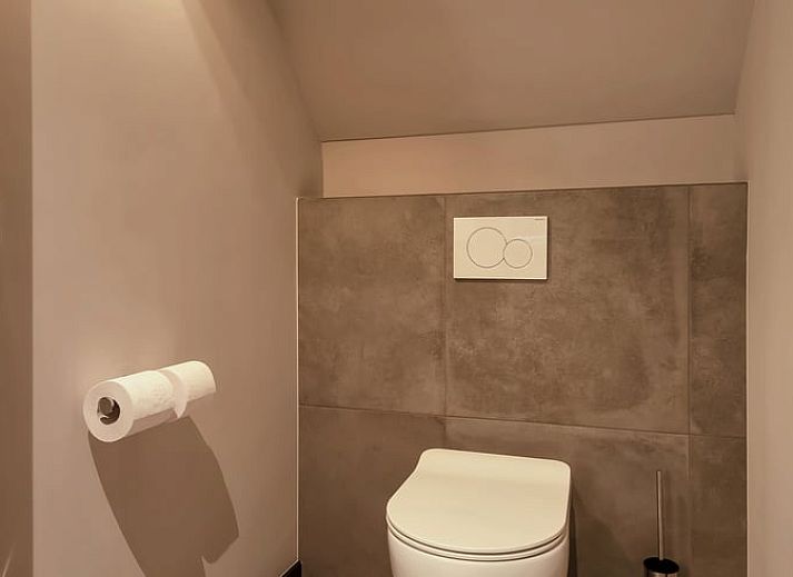 Attractive bedroom in Holiday Home in Milheeze, North Brabant with luxurious bed and soothing furnishings.