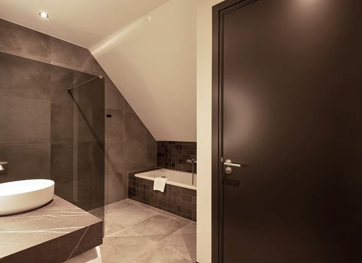 Attractive bedroom in Holiday Home in Milheeze, North Brabant with luxurious bed and soothing furnishings.