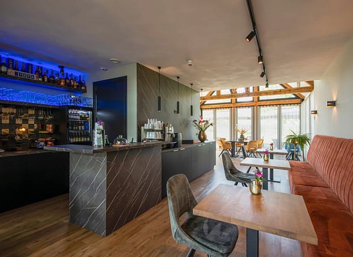 Modern bathroom with bathtub in Holiday home in Milheeze, De Peel, for ultimate relaxation.