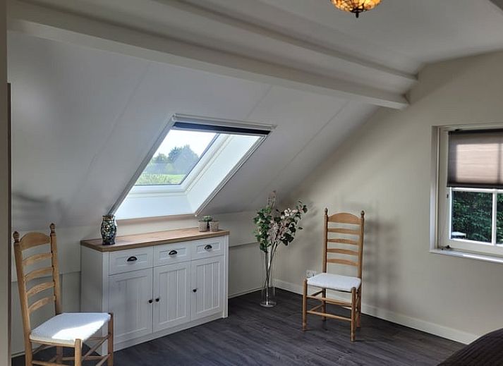 Spacious terrace at Cottage in Zeeland with seating and green surroundings in De Peel, North Brabant.