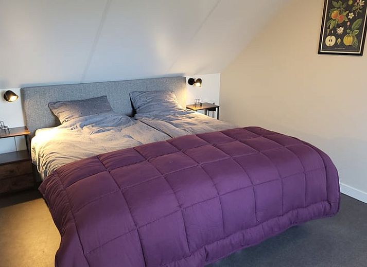 Bright dining area in Cottage in Zeeland overlooking the garden, ideal for a relaxing vacation in De Peel.