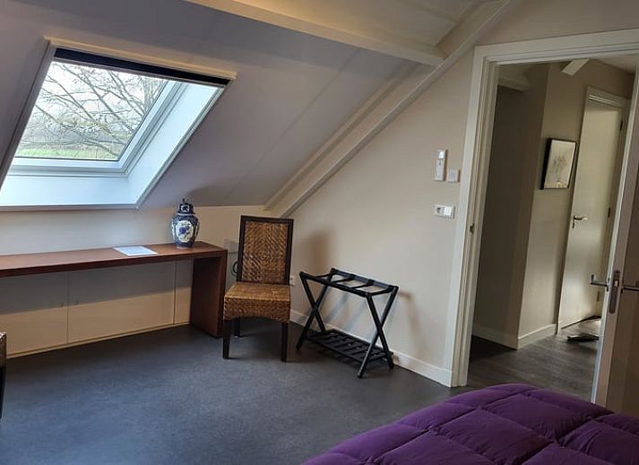 Bright dining area in Cottage in Zeeland overlooking the garden, ideal for a relaxing vacation in De Peel.