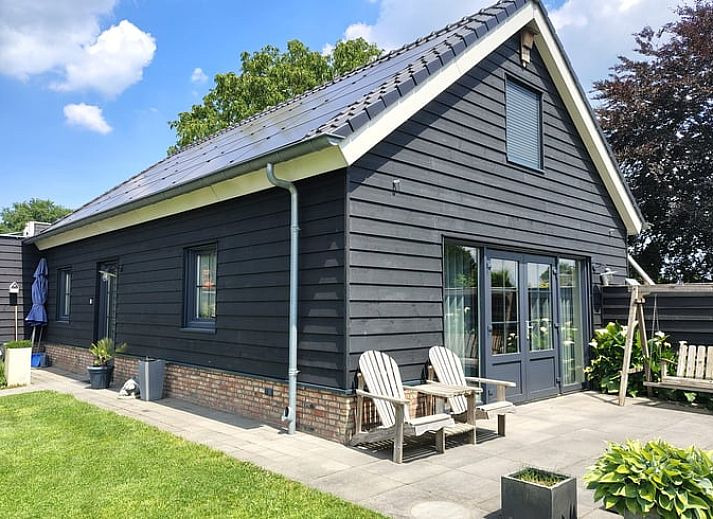 Bright dining area in Cottage in Zeeland overlooking the garden, ideal for a relaxing vacation in De Peel.