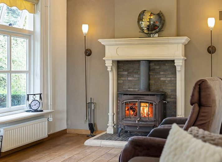 Charmant vakantiehuisje in Deurne, De Peel, Noord Brabant, omgeven door groene natuur en rustieke tuin.