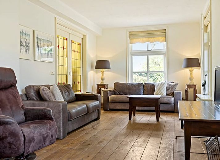 Charmant vakantiehuisje in Deurne, De Peel, Noord Brabant, omgeven door groene natuur en rustieke tuin.