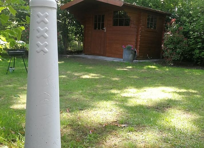 Gezellige binnenruimte met open haard in Huisje in Lage Mierde, Kempen, Noord Brabant.